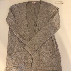 Size 7/8 girls cardigan with pockets. New with tag.